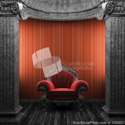 Image of stone columns, chair and wallpaper