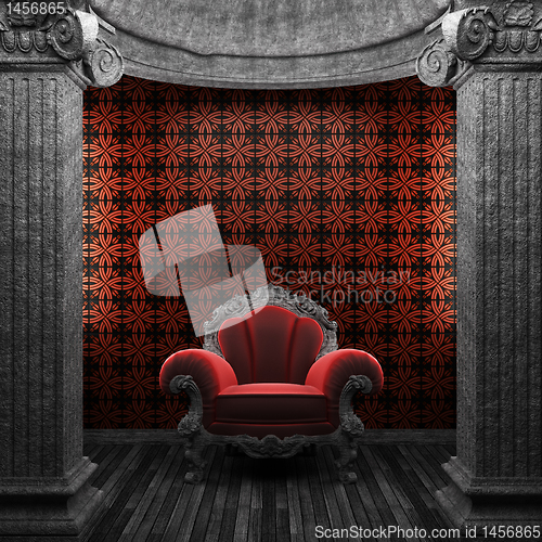 Image of stone columns, chair and tile wall