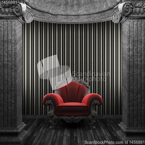 Image of stone columns, chair and wallpaper