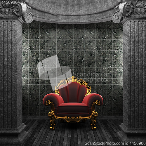 Image of stone columns, chair and tile wall