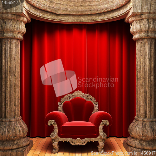 Image of red velvet curtains, wood columns and chair