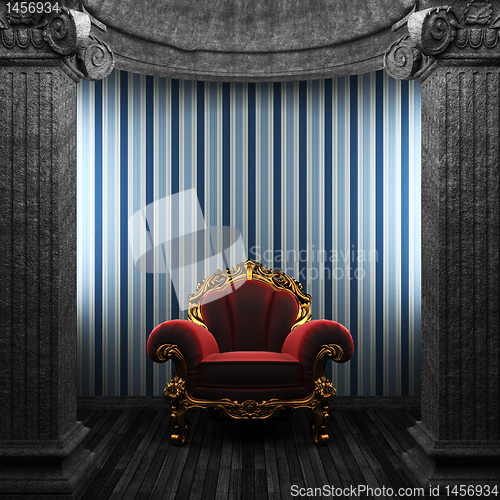 Image of stone columns, chair and wallpaper