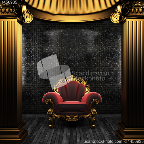 Image of bronze columns, chair and tile wall