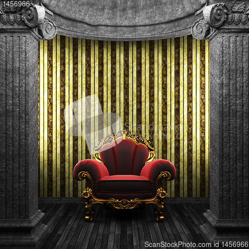 Image of stone columns, chair and wallpaper