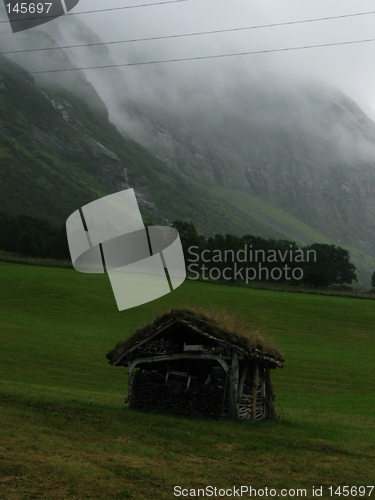 Image of Old cabin in front of montain, westcoast Norway