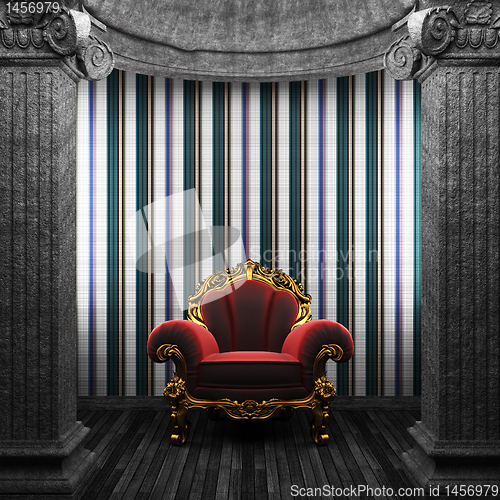 Image of stone columns, chair and tile wall