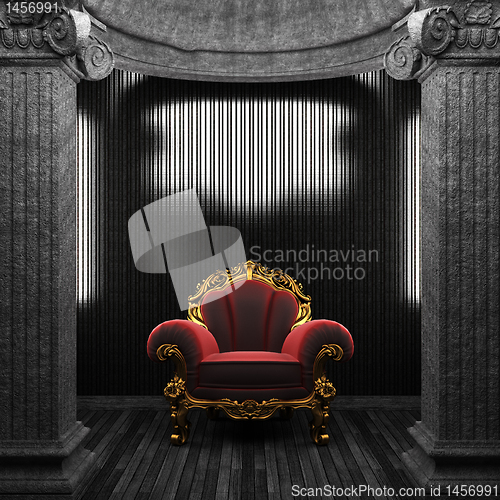 Image of stone columns, chair and tile wall