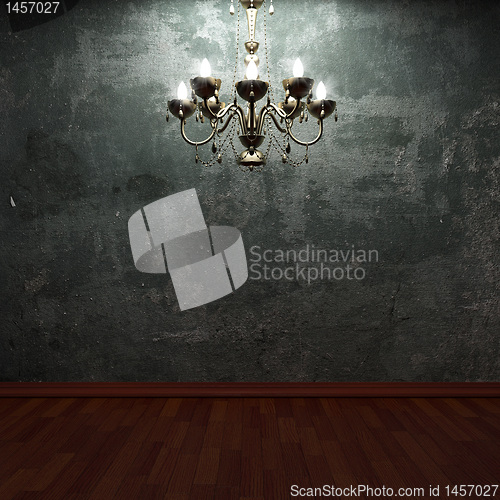 Image of old concrete wall and chandelier