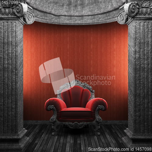 Image of stone columns, chair and wallpaper