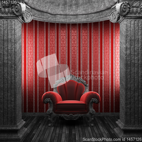 Image of stone columns, chair and wallpaper