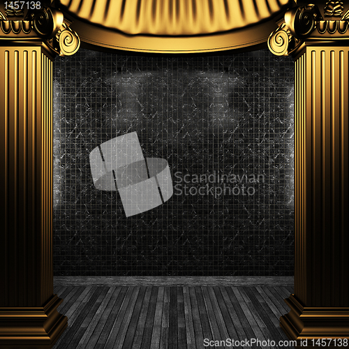 Image of bronze columns and tile wall