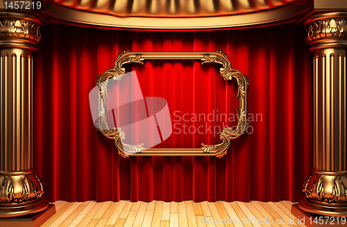 Image of red curtains, gold columns and frames