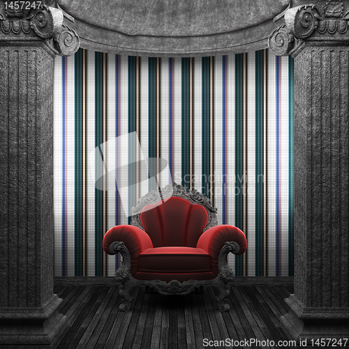 Image of stone columns, chair and tile wall