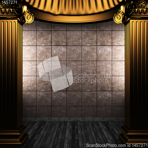 Image of bronze columns and tile wall