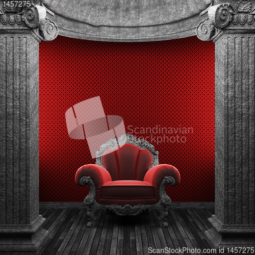 Image of stone columns, chair and wallpaper