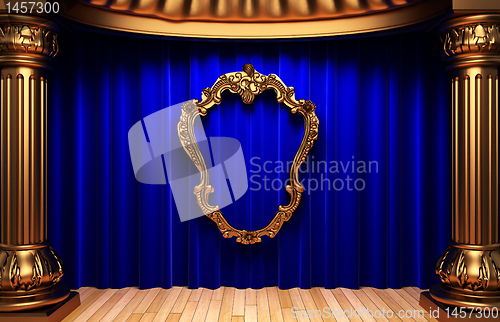 Image of blue curtains, gold columns and frames