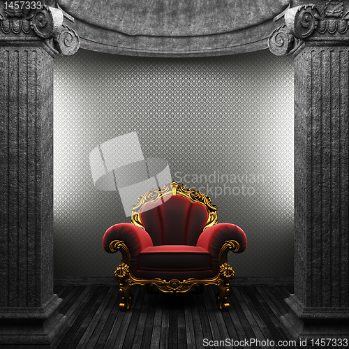 Image of stone columns, chair and wallpaper