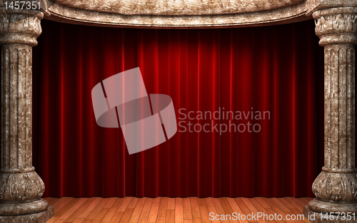 Image of red velvet curtains behind the stone columns