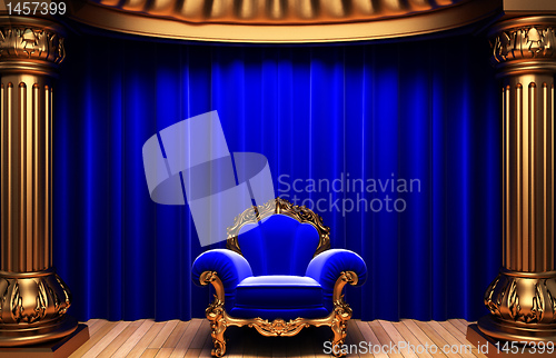 Image of blue velvet curtains, gold columns and chair