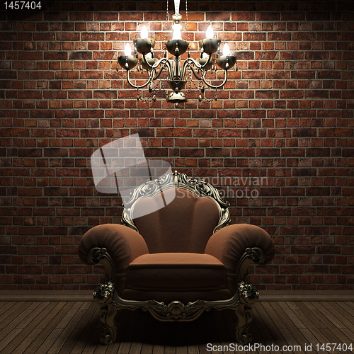 Image of illuminated brick wall and chair