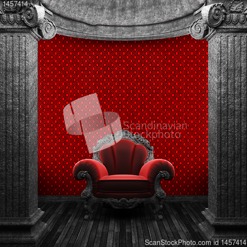 Image of stone columns, chair and wallpaper