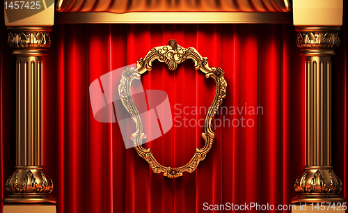 Image of red curtains, gold columns and frames