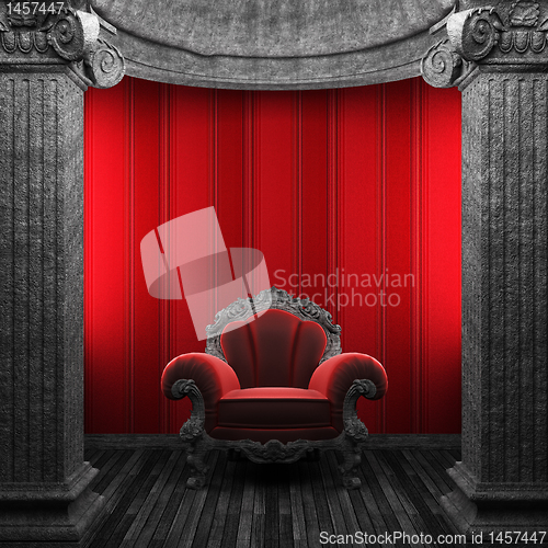 Image of stone columns, chair and wallpaper