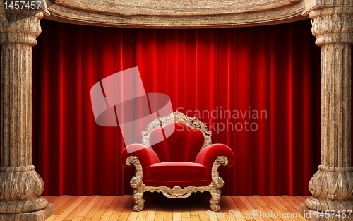 Image of red velvet curtains, wood columns and chair