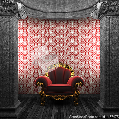 Image of stone columns, chair and wallpaper