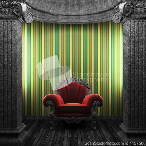 Image of stone columns, chair and wallpaper