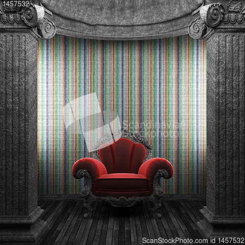 Image of stone columns, chair and tile wall