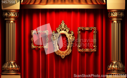 Image of red curtains, gold columns and frames