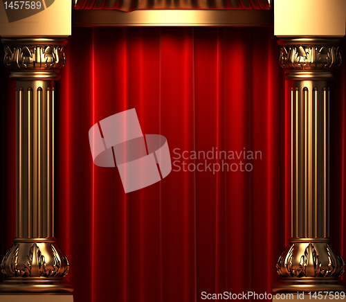 Image of red velvet curtains behind the gold columns