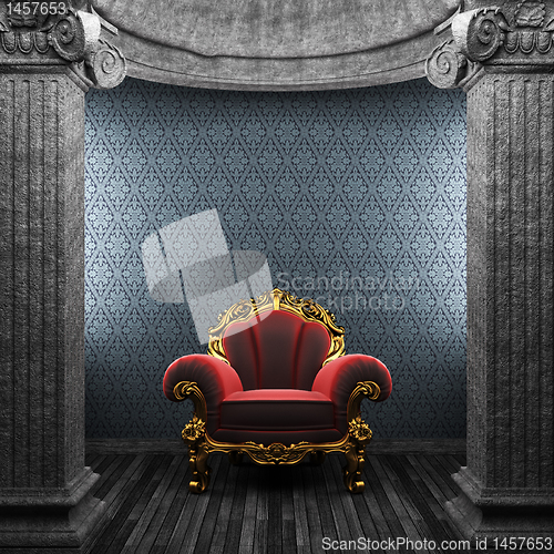 Image of stone columns, chair and wallpaper