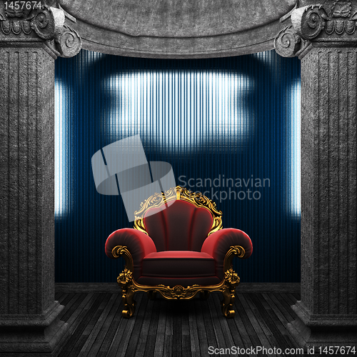 Image of stone columns, chair and tile wall