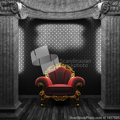 Image of stone columns, chair and wallpaper