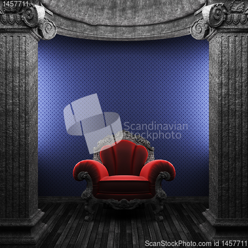 Image of stone columns, chair and wallpaper
