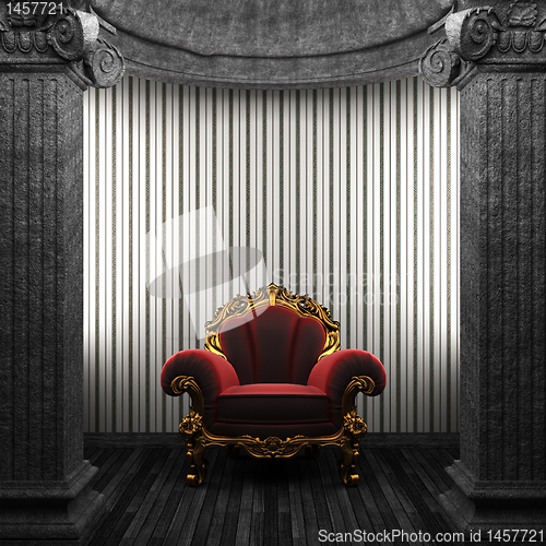 Image of stone columns, chair and wallpaper