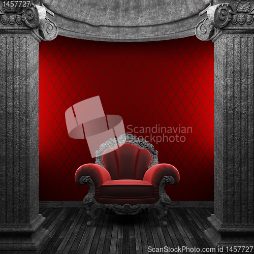 Image of stone columns, chair and wallpaper