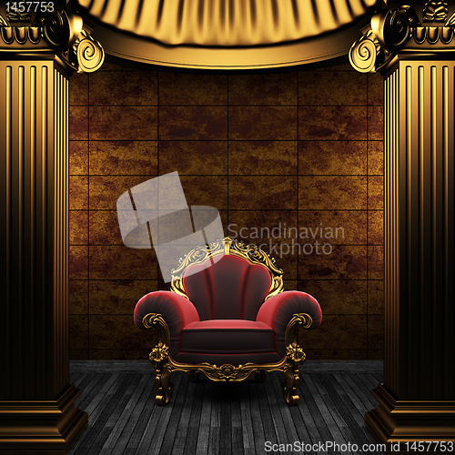 Image of bronze columns, chair and tile wall