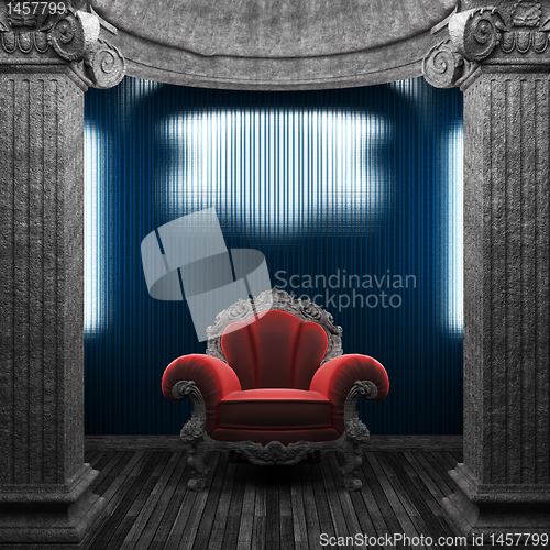 Image of stone columns, chair and tile wall