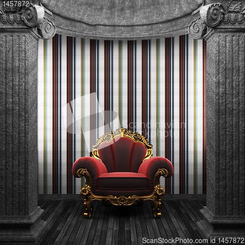 Image of stone columns, chair and tile wall