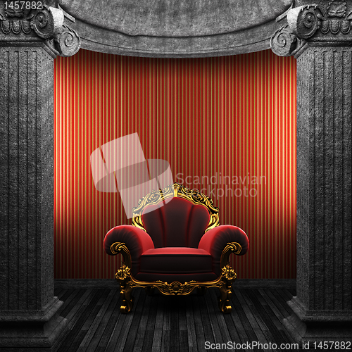 Image of stone columns, chair and wallpaper