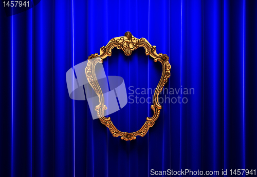 Image of blue curtains, gold frame