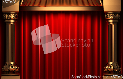 Image of red velvet curtains behind the gold columns