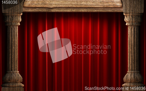 Image of red velvet curtains behind the old wood columns