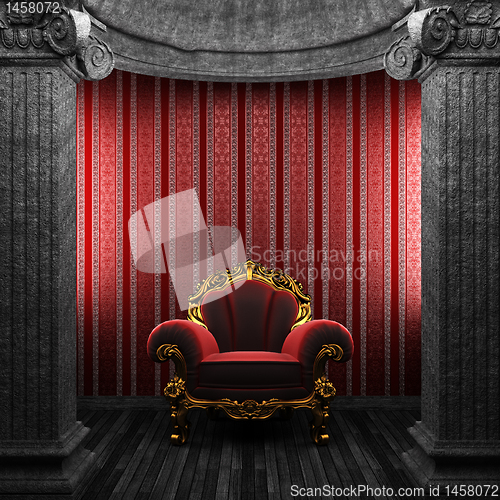 Image of stone columns, chair and wallpaper