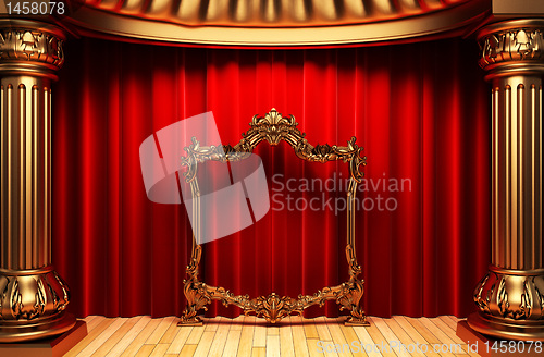 Image of red curtains, gold columns and frames