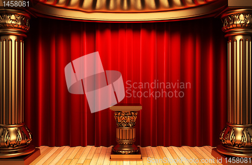 Image of red velvet curtains, gold columns and Pedestal