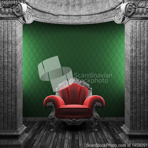 Image of stone columns, chair and wallpaper